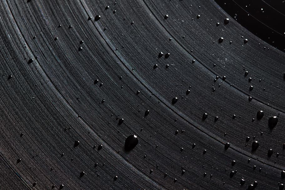 droplets on vinyl disc close-up photography, universe, planet