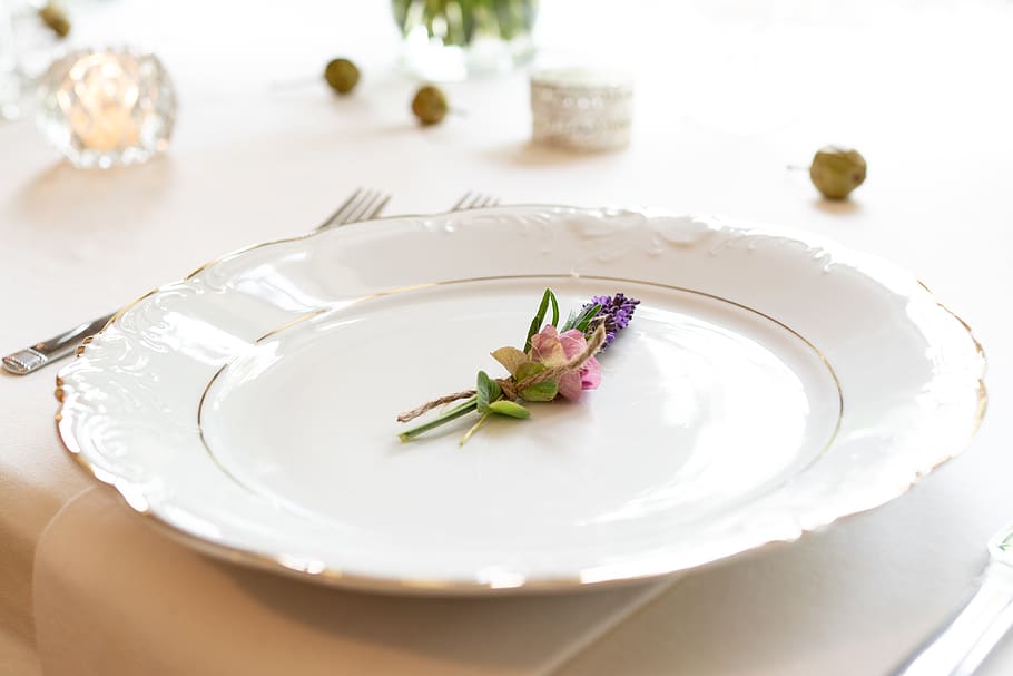 Close-up Photo of Pink and Purple Flower on Scalloped Edge White Ceramic Plate Beside Silver Fork and Spoon on Table HD wallpaper