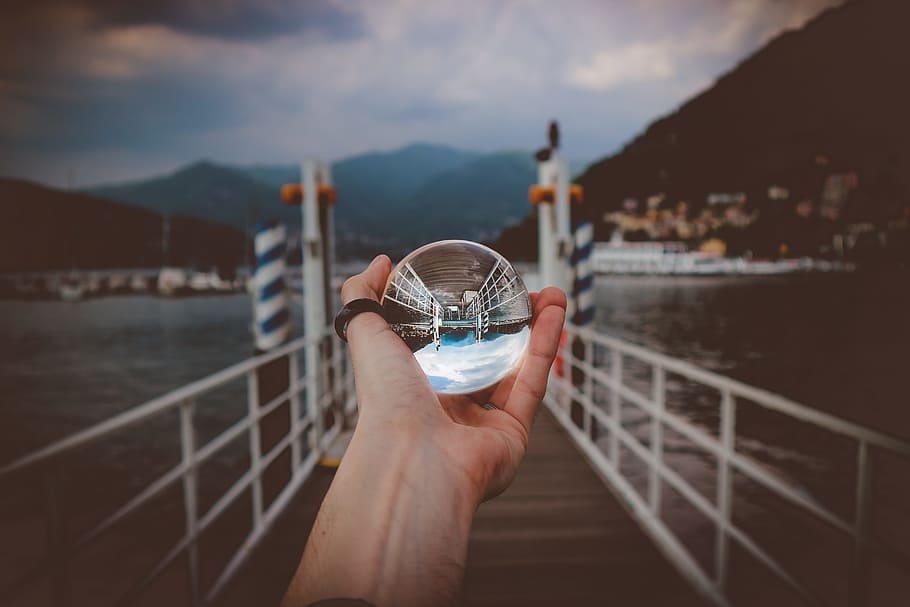 Person Holding Clear Glass Ball, bay, beach, clouds, crystal ball HD wallpaper