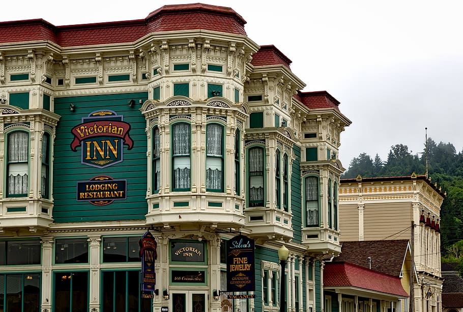 White, Green, and Red Victorian Inn Lodging Restaurant Building Near Trees HD wallpaper