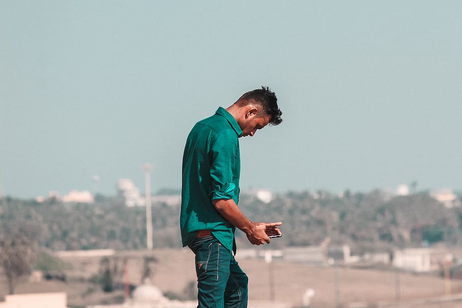 man in green top, clothing, apparel, pants, human, person, denim HD wallpaper