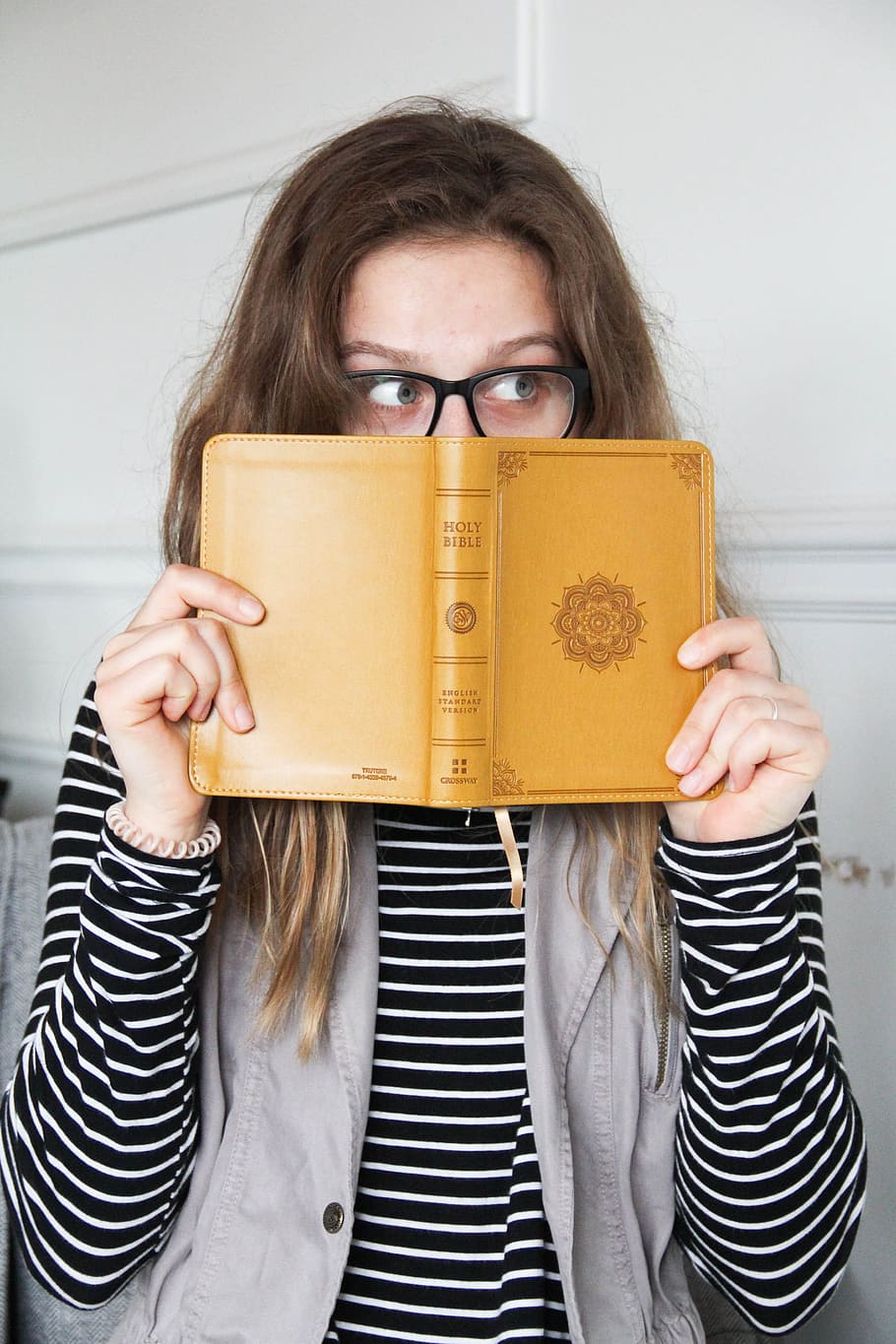 person holding book, woman, read, devotional, bible, faith, holy