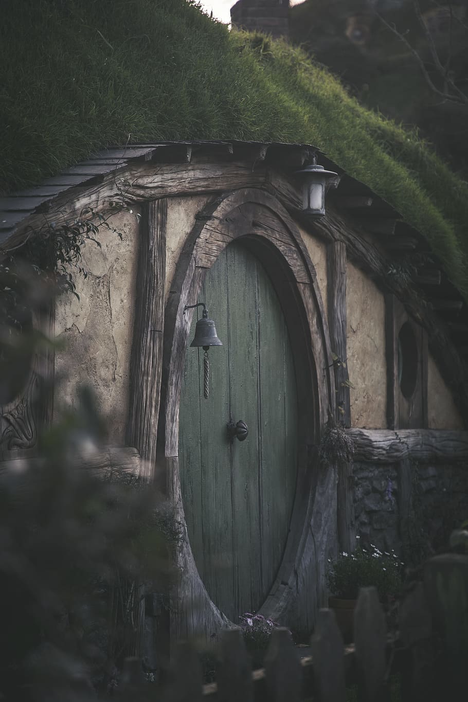 green and wooden tunnel house, hobbit, hut, adventure, new zealand