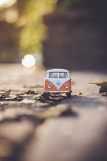 Selective Focus Photography of White Volkswagen T2 Van Model on Ground HD wallpaper