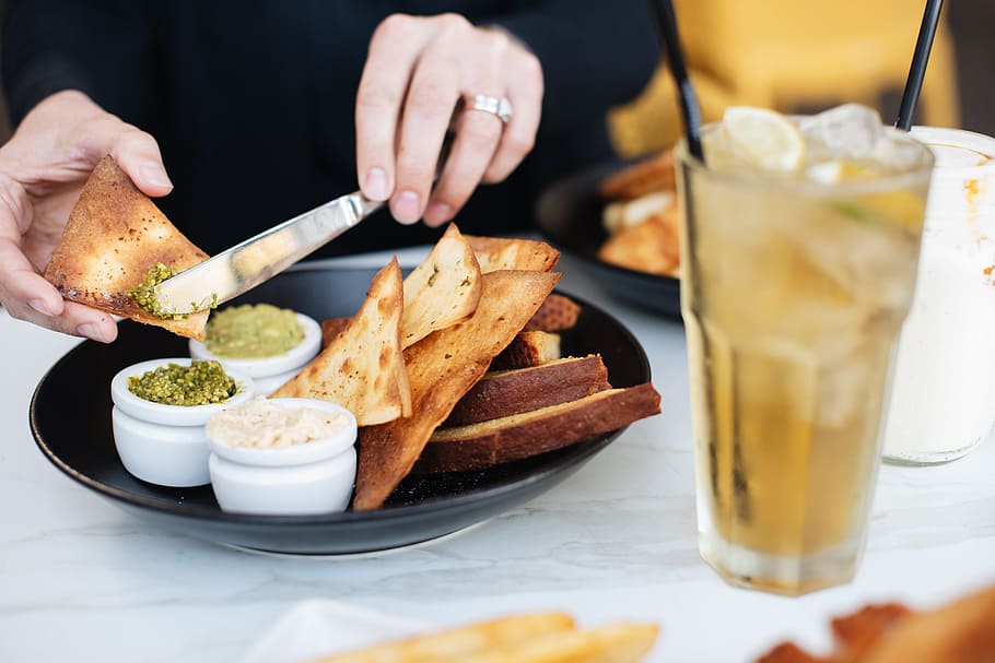 person putting spread on toasted bread, dip, table, drink, ice HD wallpaper