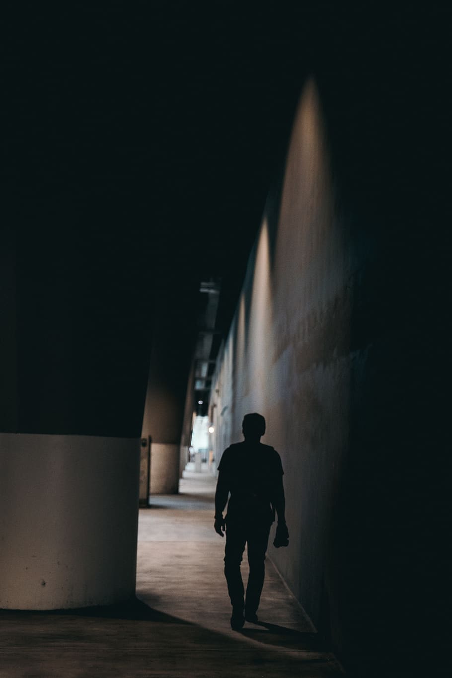 a man under a dark bridge, architecture, rear view, one person HD wallpaper