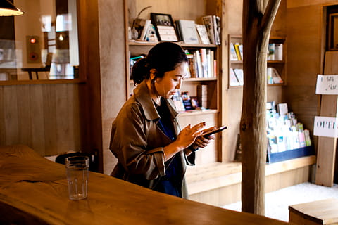 woman using mobile phone, furniture, human, person, wood, shelf HD wallpaper