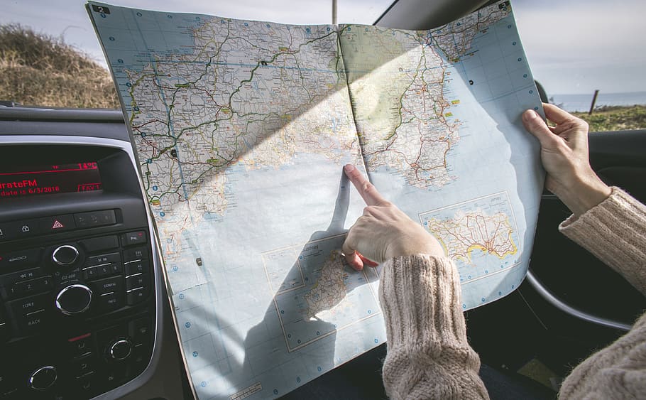 Person Wearing Beige Sweater Holding Map Inside Vehicle, adult, HD wallpaper
