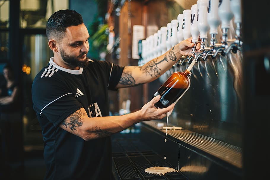 man holding brown glass bottle, male, taps, alcohol, booze, bar, HD wallpaper