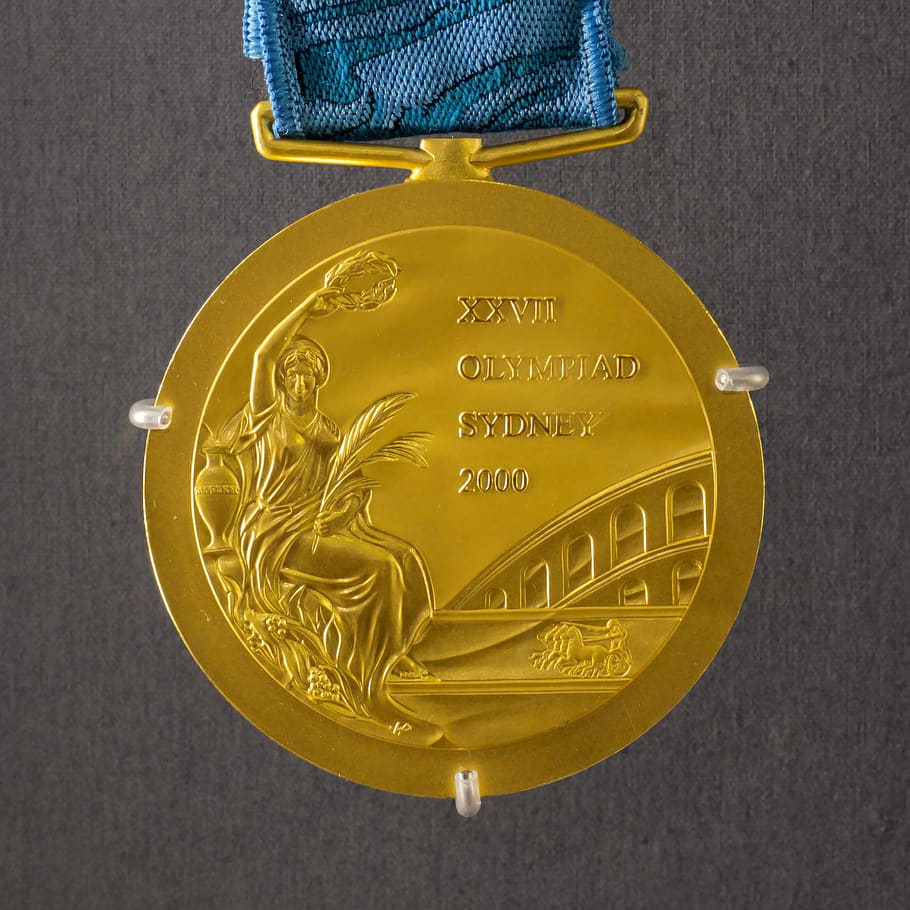 round gold-colored medal, gold medal, royal australian mint, trophy