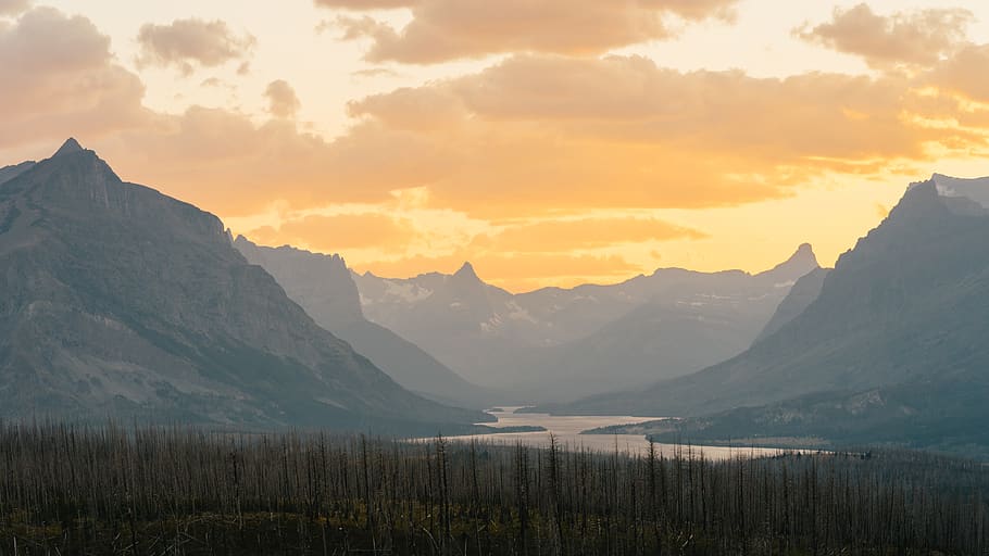 trees across mountains, sky, beauty in nature, scenics - nature HD wallpaper