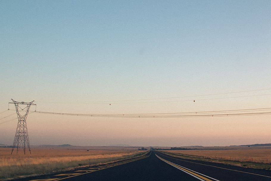 empty road between brown grass field during daytime, electricity HD wallpaper