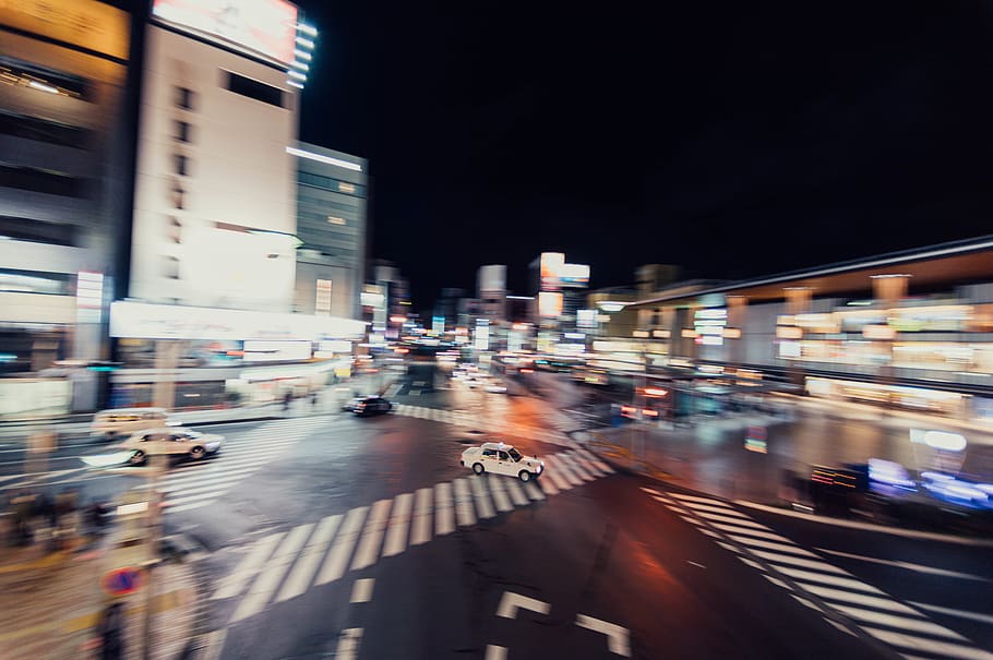 white car passing through, blurred motion, night, city, architecture HD wallpaper