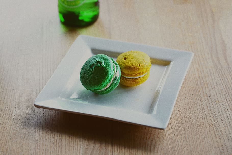 two macarons in square white plate, yellow, macaroon, green, cookie HD wallpaper