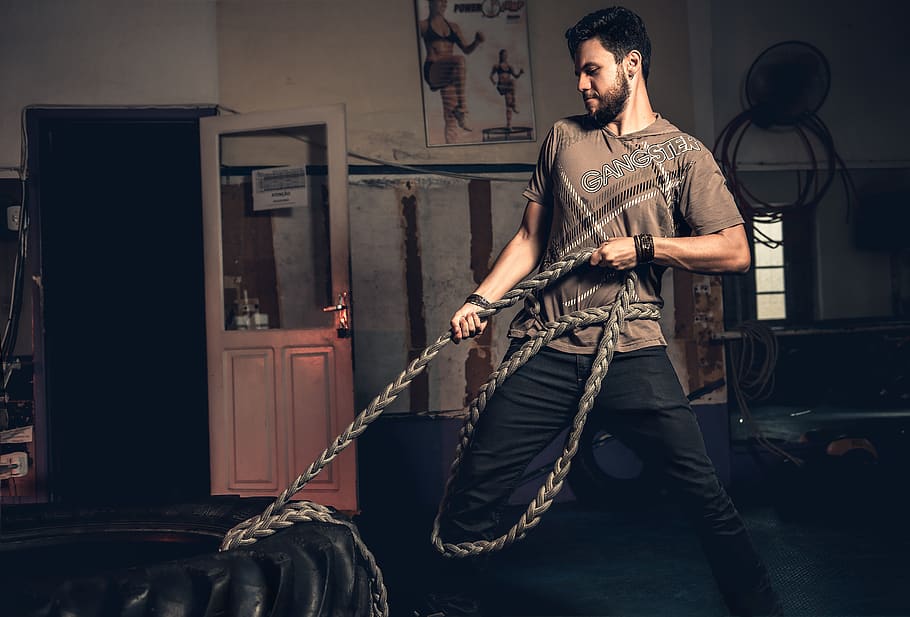 Man Pulling Rope Tied on Truck Tire, active, adult, band, body