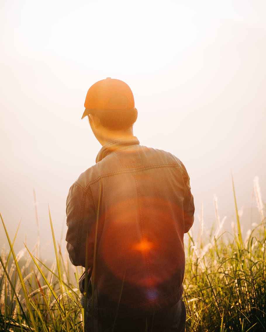 HD wallpaper: Man Standing on Mountain Top, back view, blur, cap, dawn ...