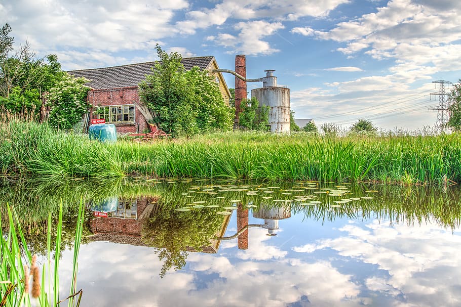 Body of Water Beside Grass, architecture, building, clouds, daylight HD wallpaper