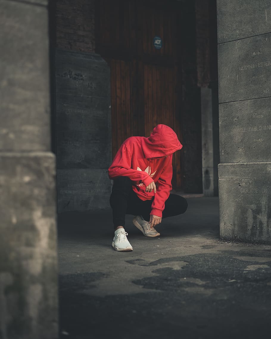 Photo of Man Wearing Hoodie While Sitting, architecture, black pants HD wallpaper