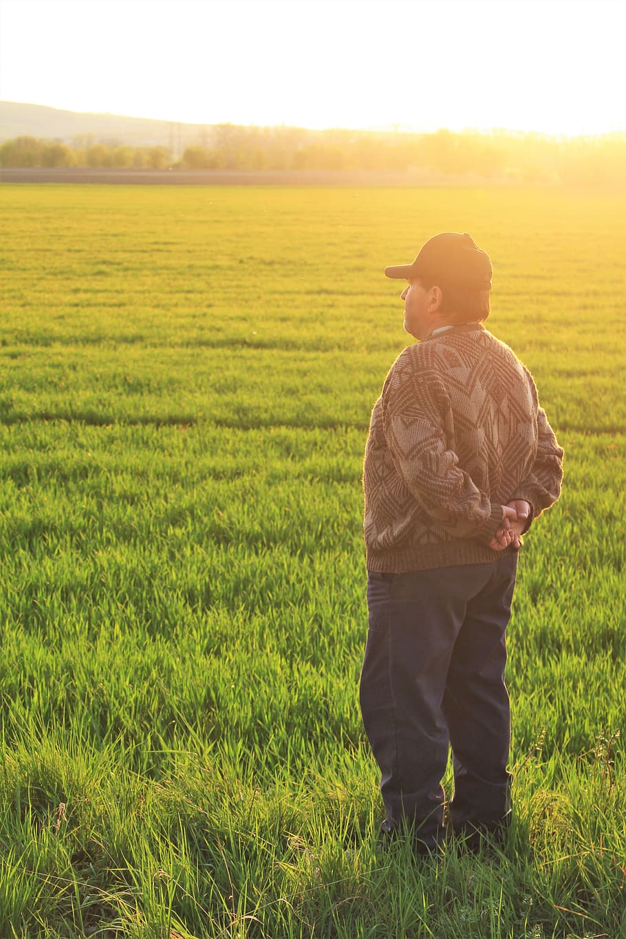 man standing on grass field, outdoors, grassland, nature, person HD wallpaper