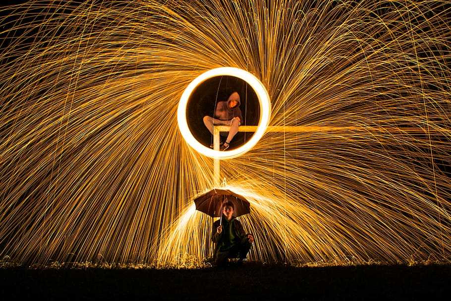 Time Lapse Photography of Person Making Firework Spark Under Person Holding Umbrella during Nighttime, HD wallpaper