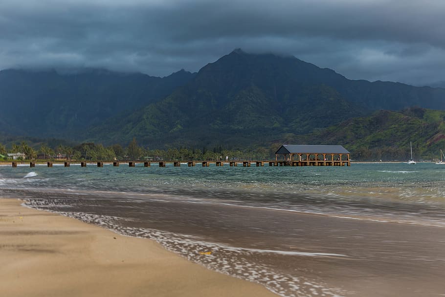 wafe, sand, cloud, hill, mountain, pier, beach, ocean, water HD wallpaper
