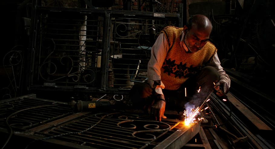 man holding welding rod, heat - temperature, one person, working HD wallpaper