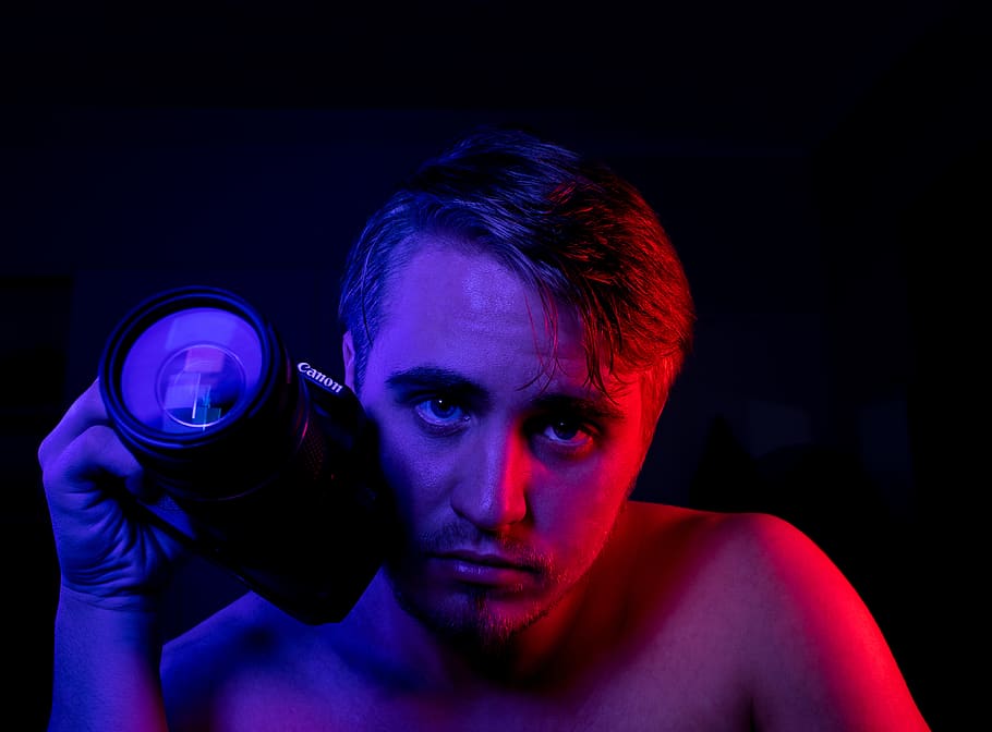 Photo of Man Holding DSLR Camera, boy, canon, dark, eyes, fine-looking HD wallpaper