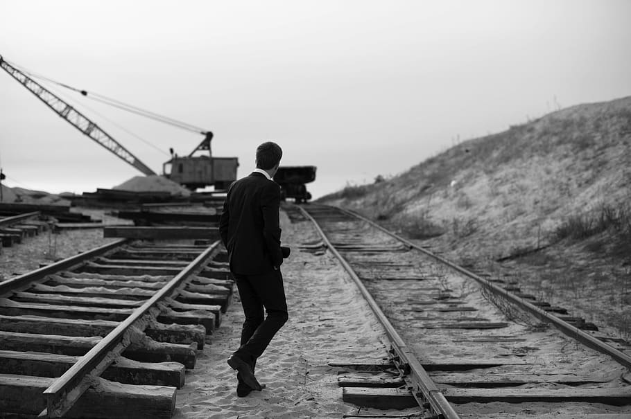 guy, man, suit, railway, railroad, train tracks, sand, crane HD wallpaper