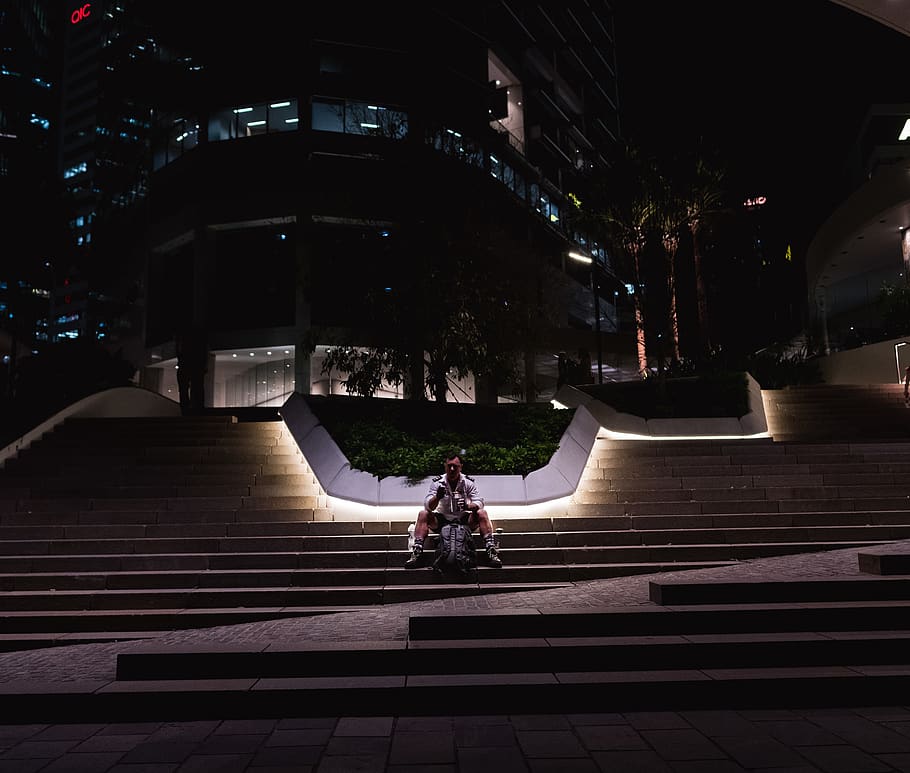 man sitting on stairs, handrail, banister, person, human, town HD wallpaper
