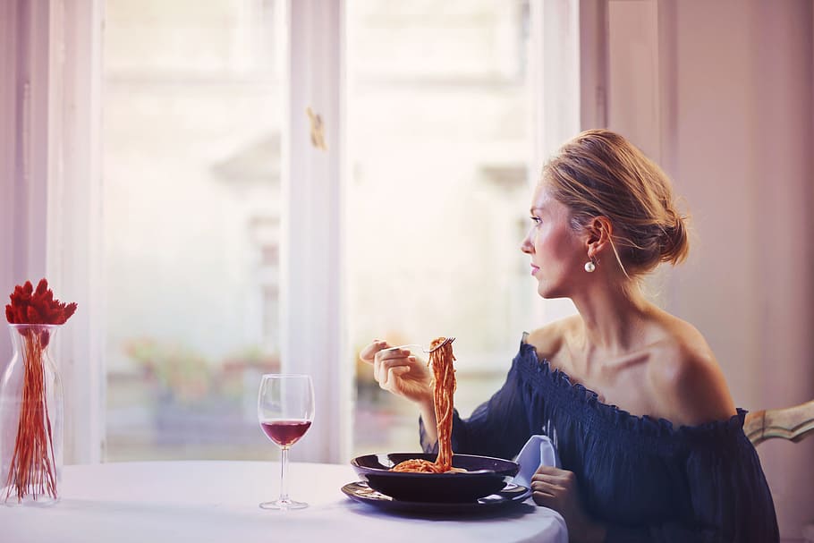 Woman Sitting on Chair While Eating Pasta Dish, adult, blond