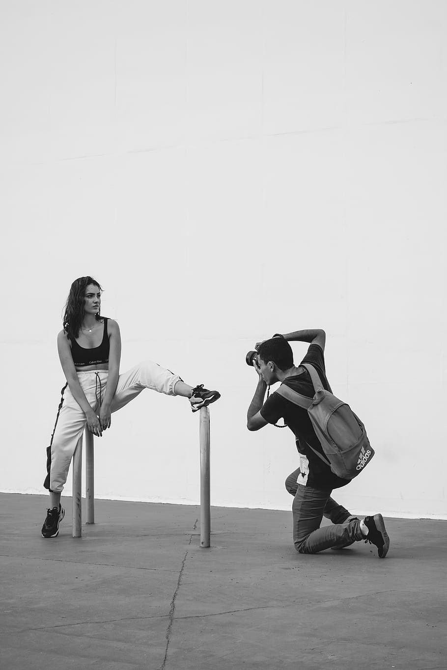 Monochrome Photography of Person Taking Photo of a Woman, backpack HD wallpaper