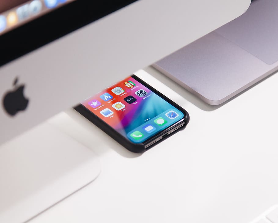black iPhone under iMac, wireless technology, communication, no people HD wallpaper