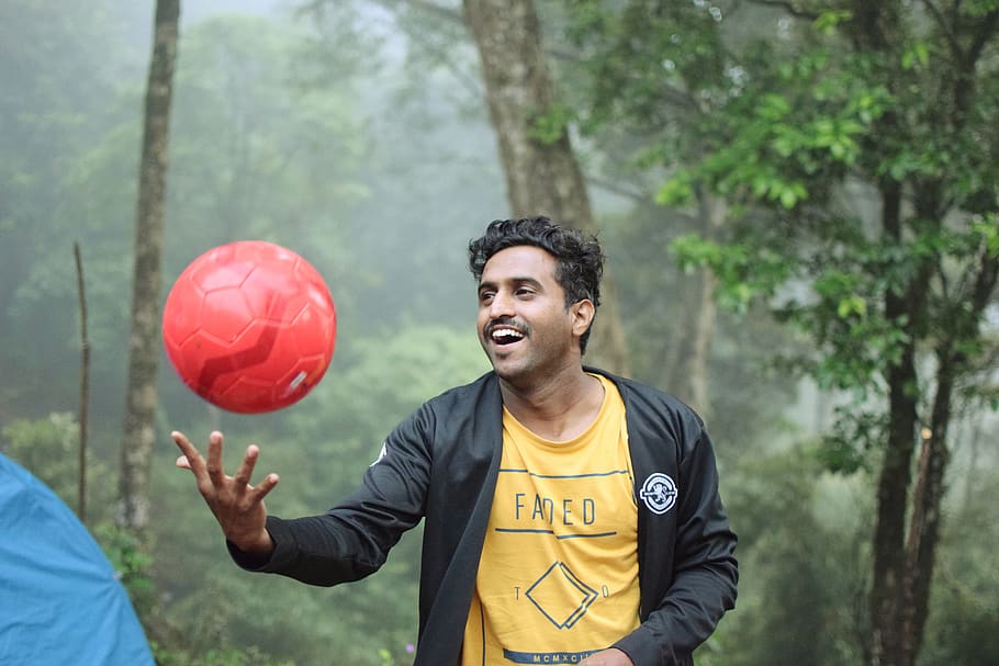 man playing red soccer ball, sphere, person, human, sports, football HD wallpaper