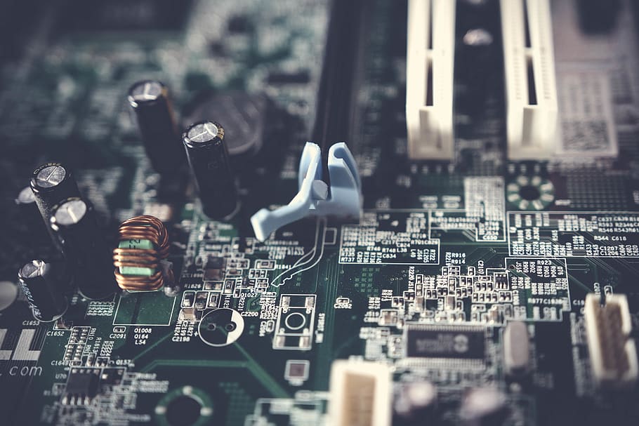 Tilt-shift Photography of Motherboard, blur, capacitors, chips HD wallpaper