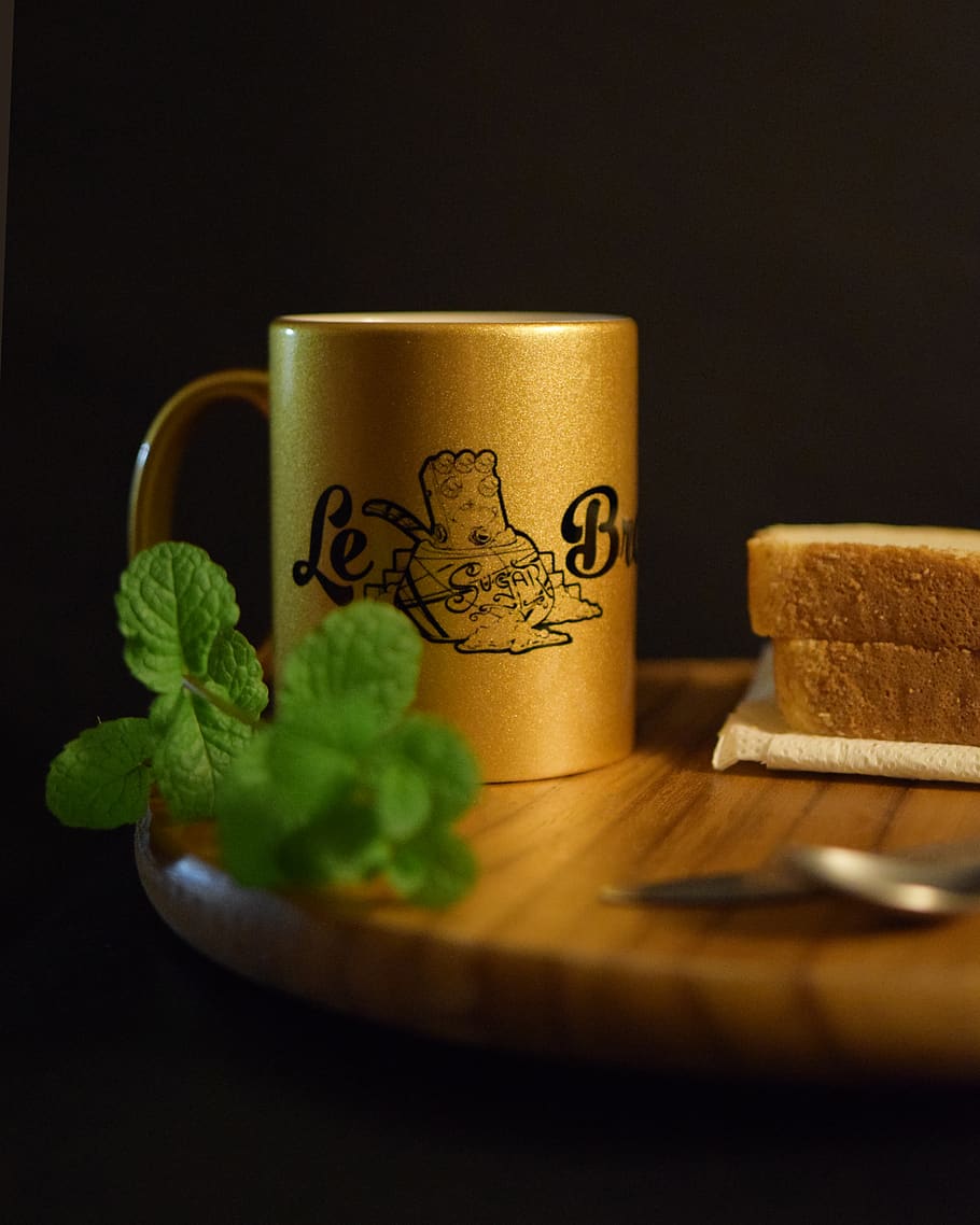 Gold-colored and Black Ceramic Mug on Brown Wooden Surface, beverage HD wallpaper