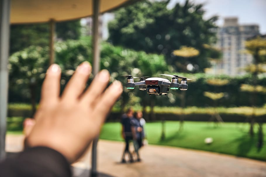 Focus Photography of Drone Flying, blur, human hand, real people HD wallpaper