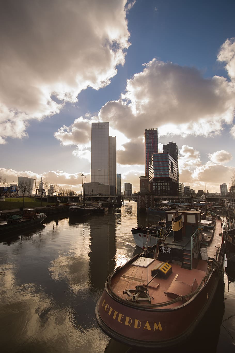 White High-rise Building Under Cloudy Sky, boat, city, clouds HD wallpaper