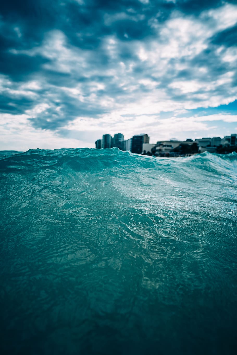Body of Water Under Cloudy Sky, beach, buildings, cancun, clouds HD wallpaper