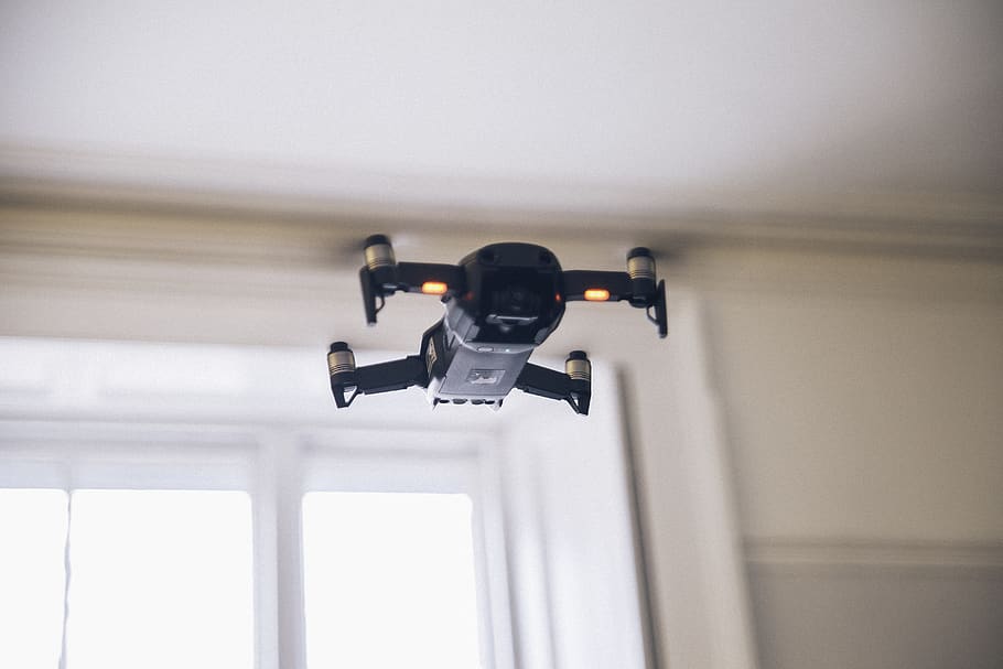 black and gray quadcopter, indoors, no people, technology, surveillance HD wallpaper