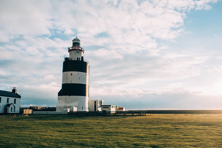 white and red concrete lighthouse, tower, grass, field, sunlight HD wallpaper