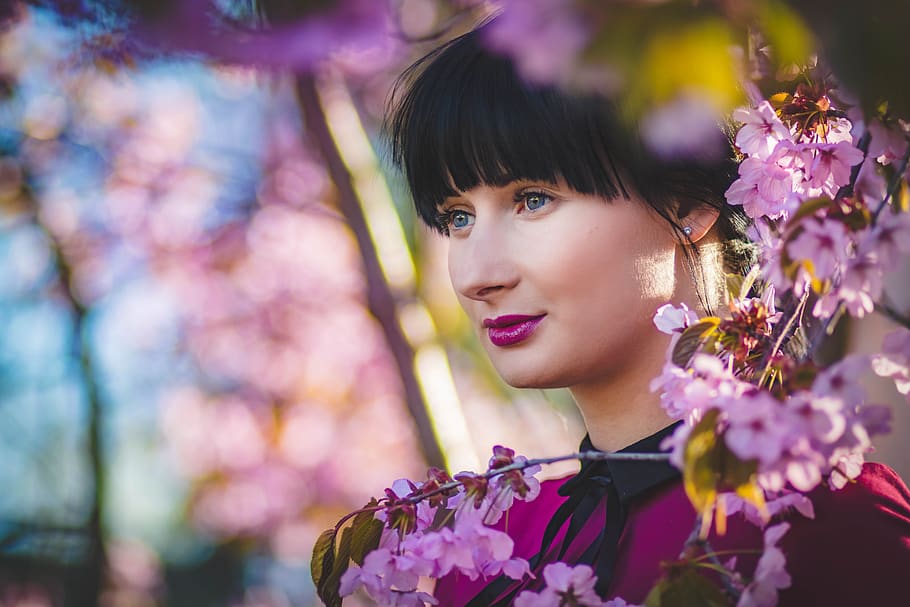 Close-Up Photography of Woman Near Flowers, attractive, bangs HD wallpaper