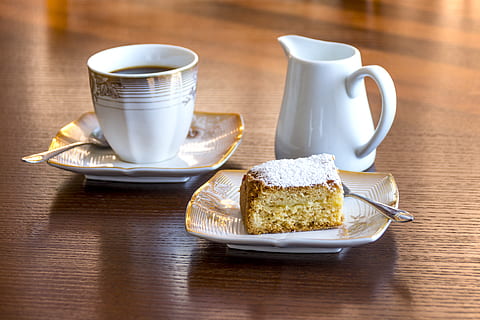White Ceramic Mug Filled With Black Liquid Beside Baked Bread on Ceramic Saucer HD wallpaper