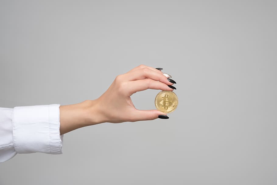 Woman Holding a Bitcoin, blockchain, commerce, conceptual, cryptocurrency HD wallpaper