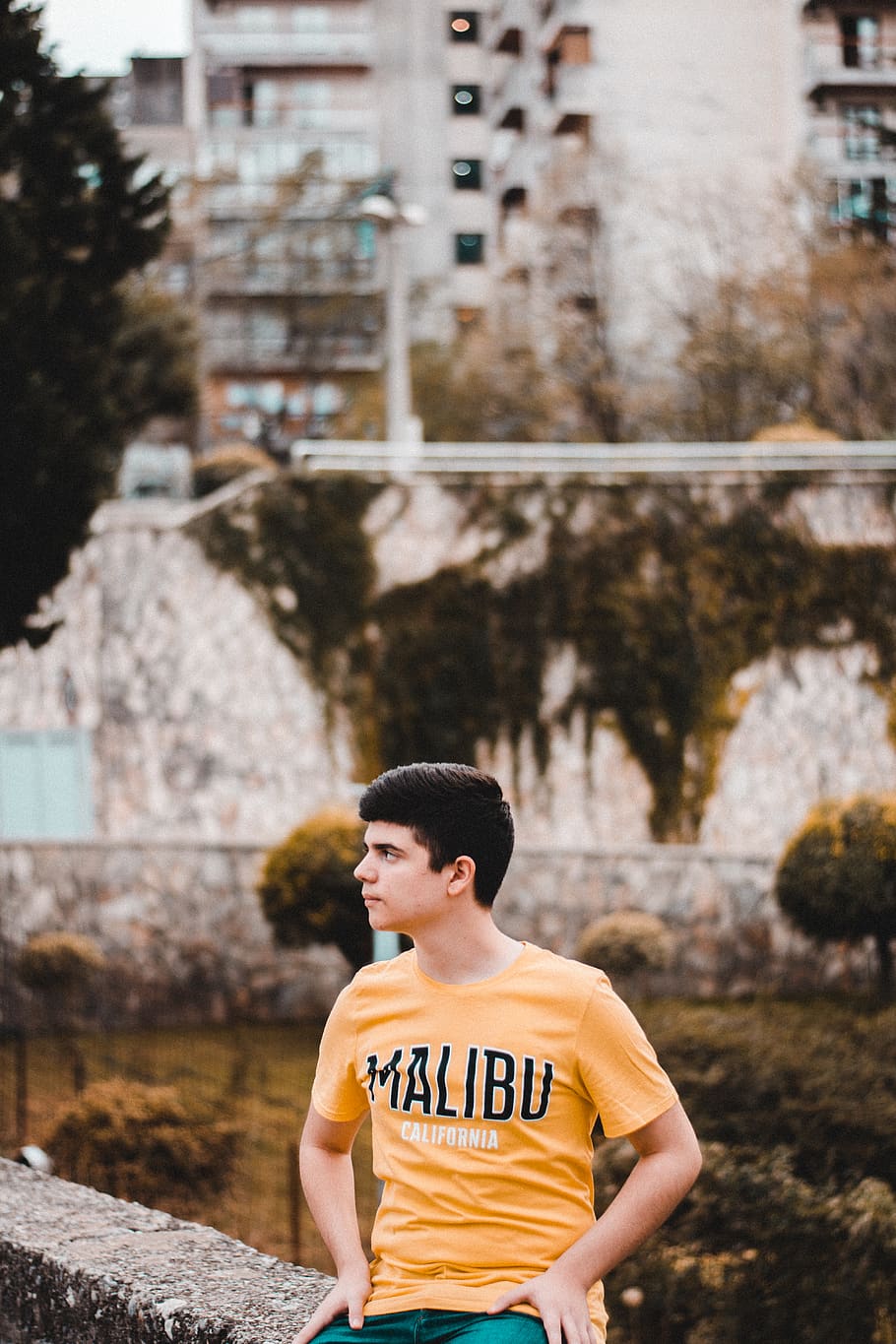 Photo Of Man In Yellow Shirt, boy, fine-looking, person, sitting HD wallpaper