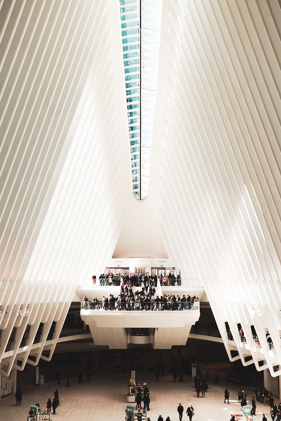 people inside white triangle-shaped building, group of people HD wallpaper