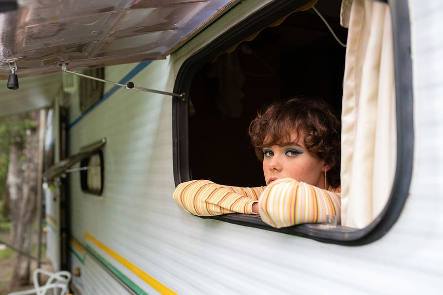 Woman at the Window of a Camper, adult, beautiful, campervan