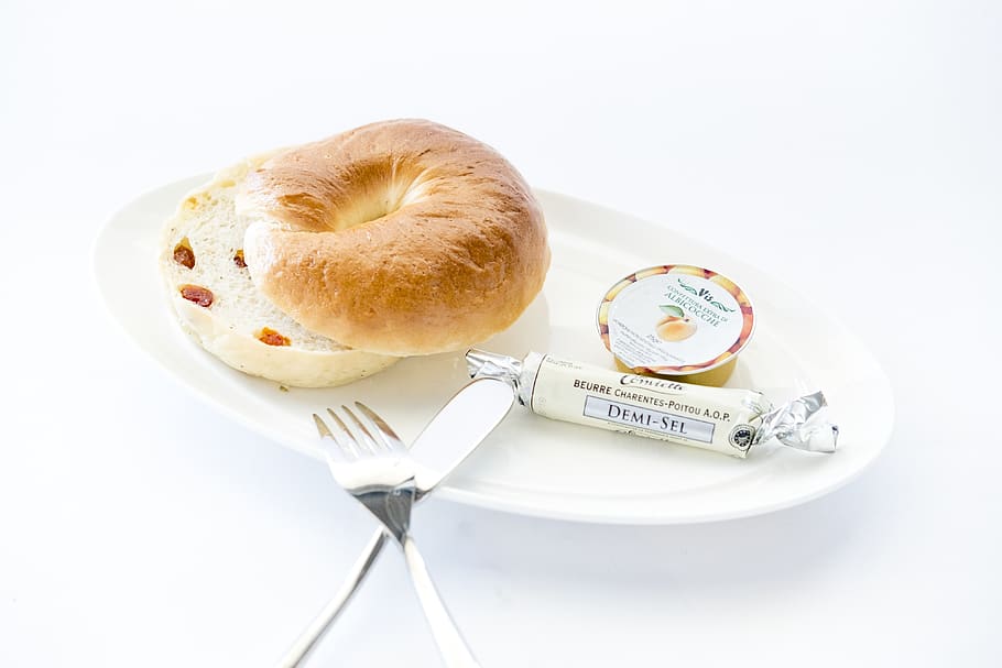 bread on white plate with fork and table knife, food, bagel, cutlery HD wallpaper