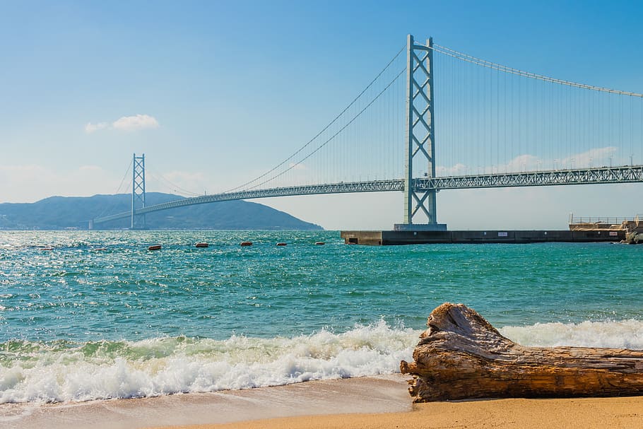suspension bridge under blue sky, water, sea, bridge - man made structure HD wallpaper