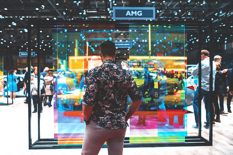 man standing on AMG display, real people, lifestyles, men, leisure activity HD wallpaper