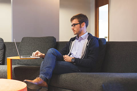 Man Sitting on Black Couch, apple, casual, digital nomad, fashion HD wallpaper